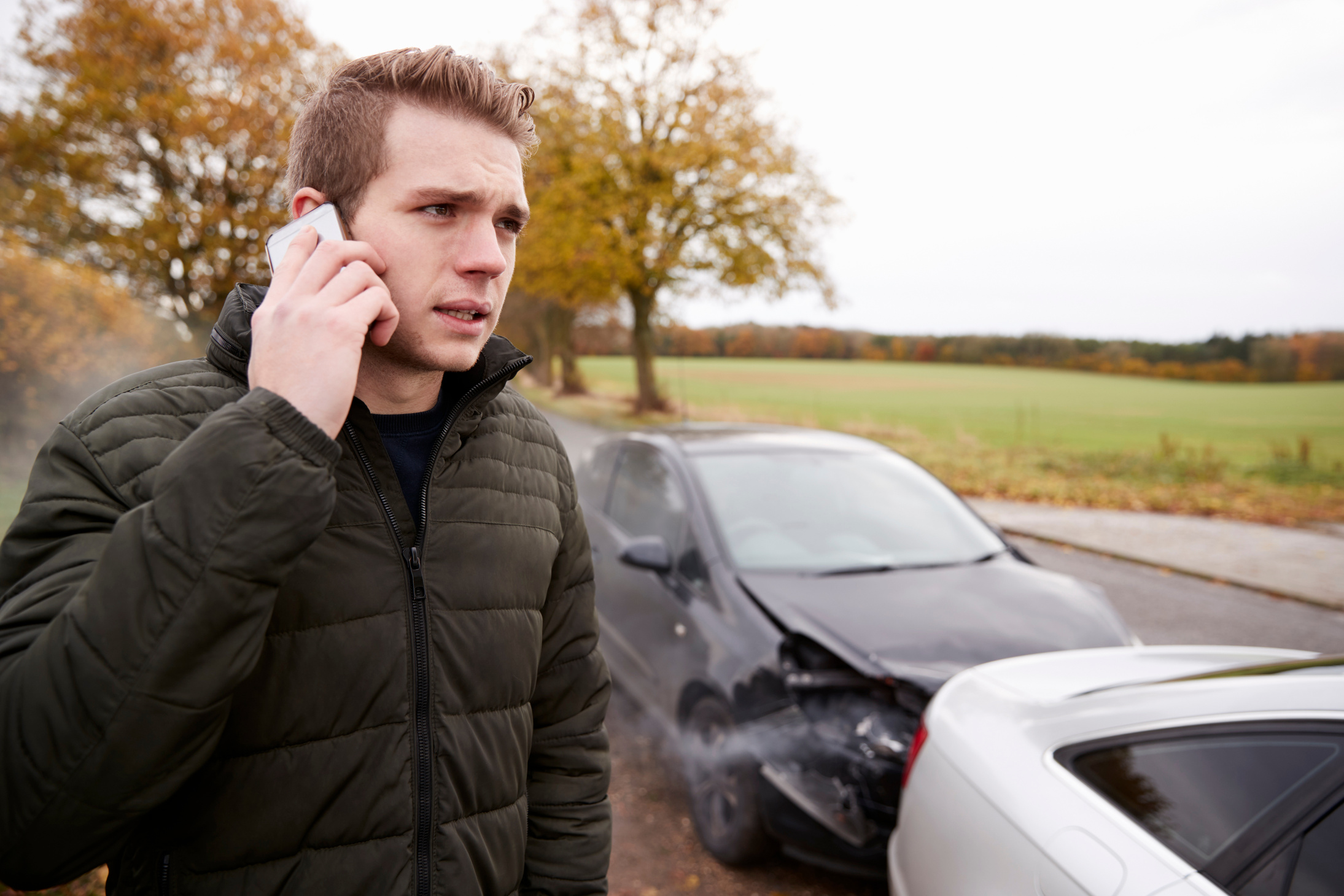 Man Calling to Report Car Accident on Country Road